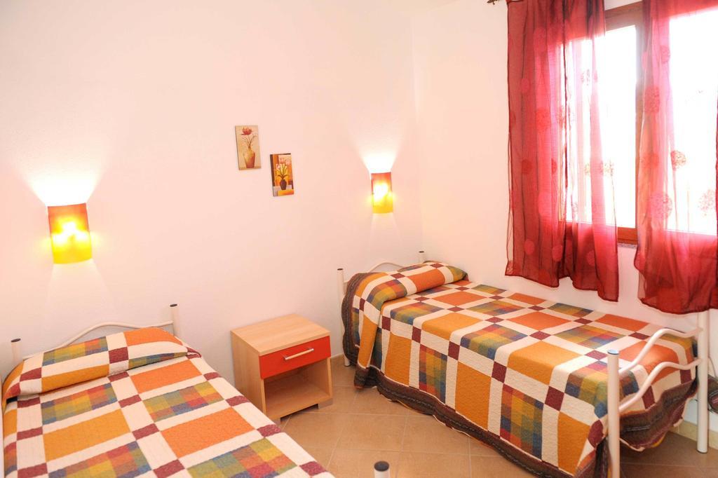 Residence Tanaunella Budoni Pokoj fotografie